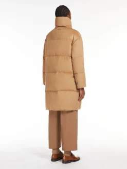 Long, reversible camel colour down jacket