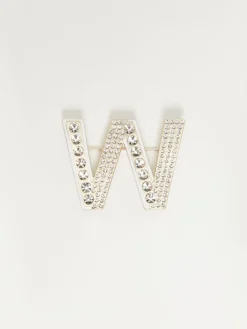 Metal brooch with rhinestones