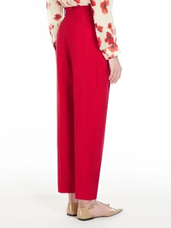 Wool satin carrot-leg trousers.